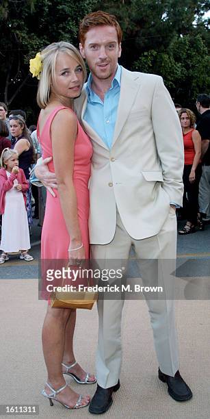 Actor Damian Lewis and his girlfriend Katie Razzall arrive at the film premiere of "Band Of Brothers" August 29, 2001 Los Angeles, CA.