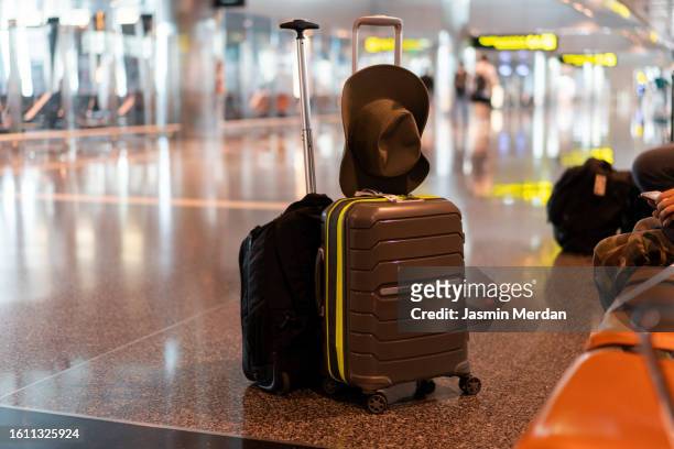 baggage in airport - terrorism stock pictures, royalty-free photos & images