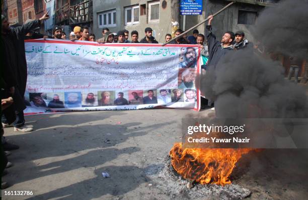 Kashmiri Muslim protesters shout anti Indian slogans after Mohammad Afzal Guru was executed for plotting to attack India's parliament on February 09,...