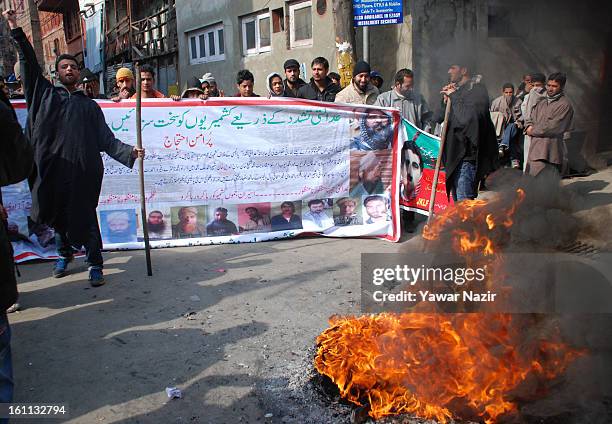 Kashmiri Muslim protesters shout anti Indian slogans after Mohammad Afzal Guru was executed for plotting to attack India's parliament on February 09,...