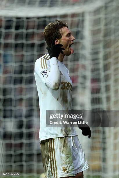 Michu of Swansea City celebrates scoring the fourth goal during the Premier League match between Swansea City and Queens Park Rangers at Liberty...