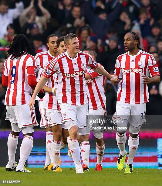 Robert Huth of Stoke City is congratulated by his team-mates after scoring the opening goal during the Barclays Premier League match between Stoke...