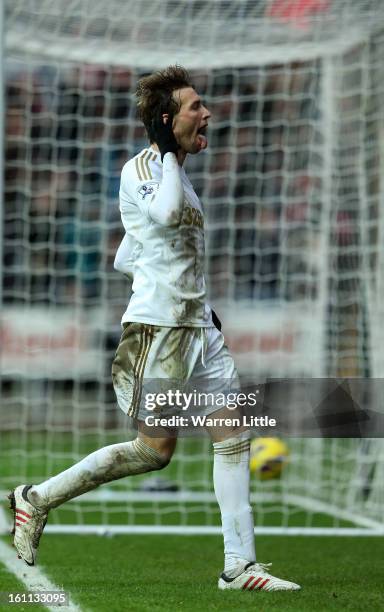 Michu of Swansea City celebrates scoring the fourth goal during the Premier League match between Swansea City and Queens Park Rangers at Liberty...