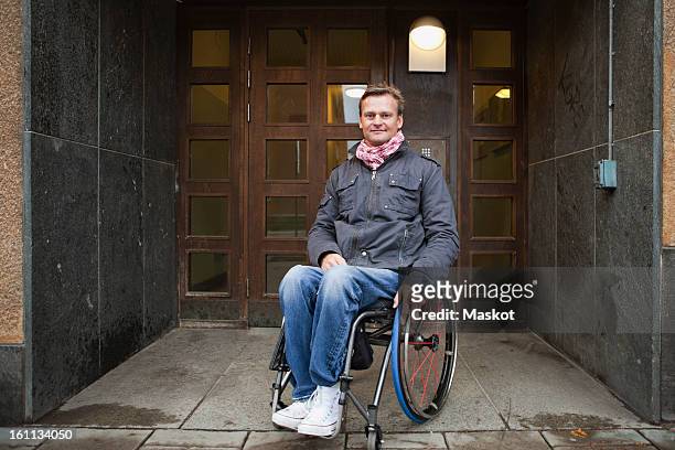 Man sitting in wheelchair looking at camera