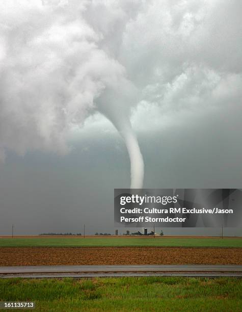 tornado column in rural landscape - tornado stockfoto's en -beelden