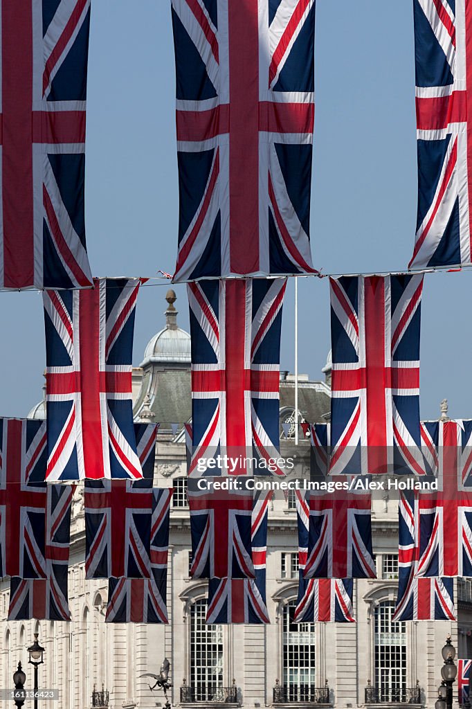 British flags hanging on city street