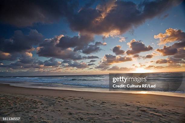 sun setting over tropical beach - travel african sunset rf photos only stock pictures, royalty-free photos & images