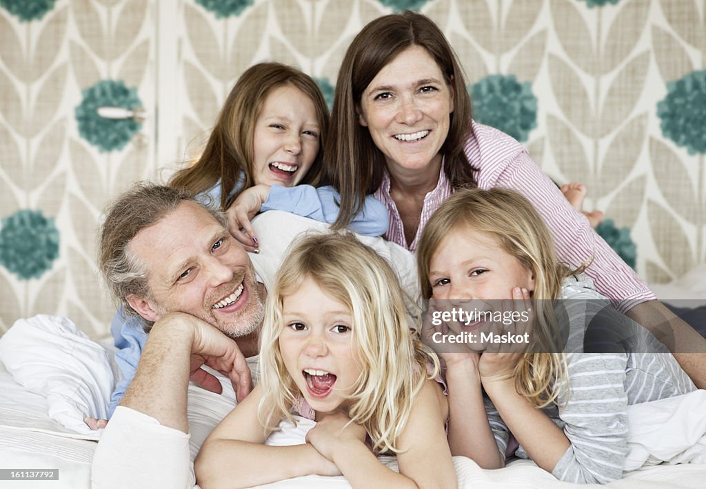 Happy mature couple with their daughters