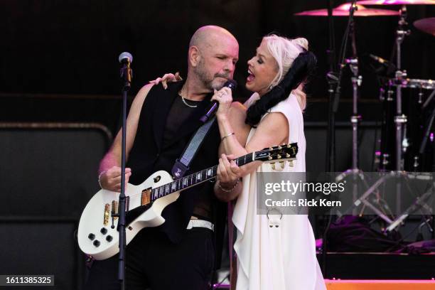 John Crawford and Terri Nunn of Berlin perform in concert during "The Letting It Go Show" at Germania Insurance Amphitheater on August 12, 2023 in...