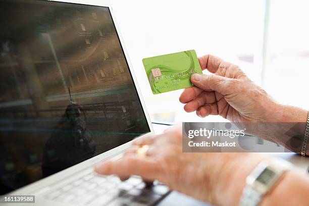 woman paying online - payment card stock pictures, royalty-free photos & images