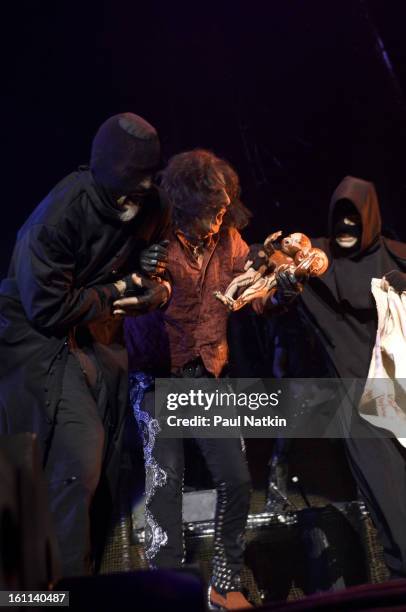 American heavy metal singer Alice Cooper and a pair of unidentified 'hangmen' perform at the Sears Centre in Hoffman Estates, Illinois, September 22,...