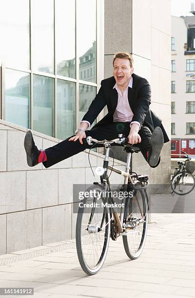 businessman on a bike - rolling stock pictures, royalty-free photos & images