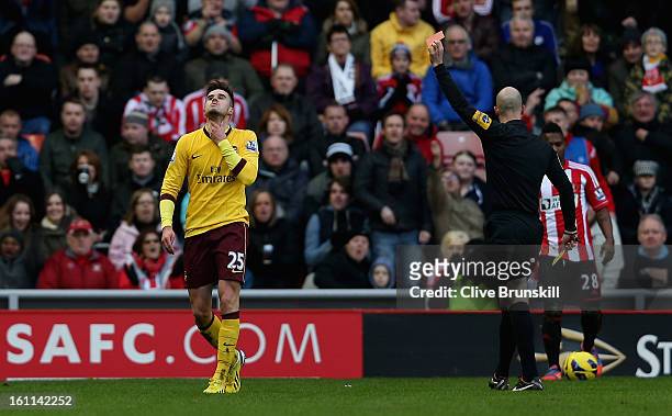 Carl Jenkinson of Arsenal is shown the red card by the referee Mr A. Taylor during the Barclays Premier League match between Sunderland and Arsenal...