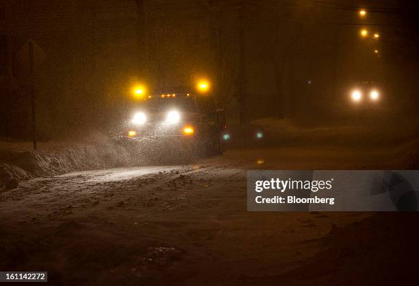 Snow plow clears Cedar Street during Winter Storm Nemo in Somerville, Massachusetts, U.S., on Friday, Feb. 8, 2013. More than two feet of snow fell...