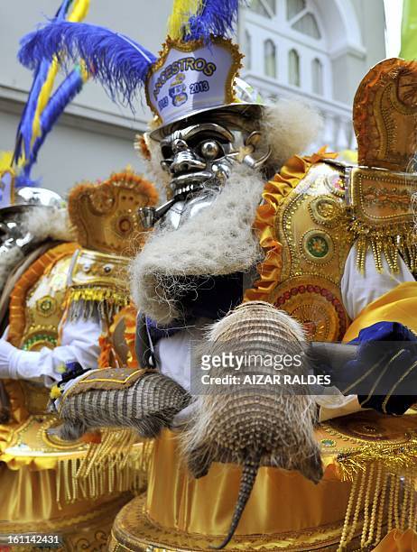 Member of the Morenada Central Cocanis de Oruro brotherhood takes part in Carnival of Oruro, in the mining town of Oruro, 240 km south of La Paz on...