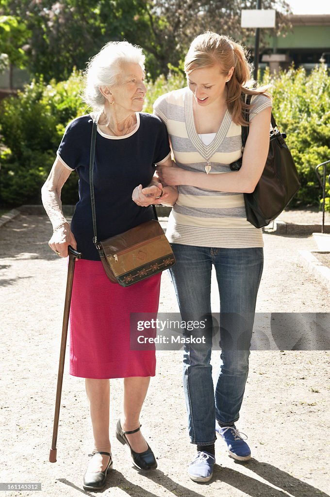 Two women walking outside