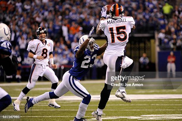 Indianapolis Colts safety Tim Jennings is to far under wide receiver Brandon Marshall during this completion in the 4th quarter as the Indianapolis...