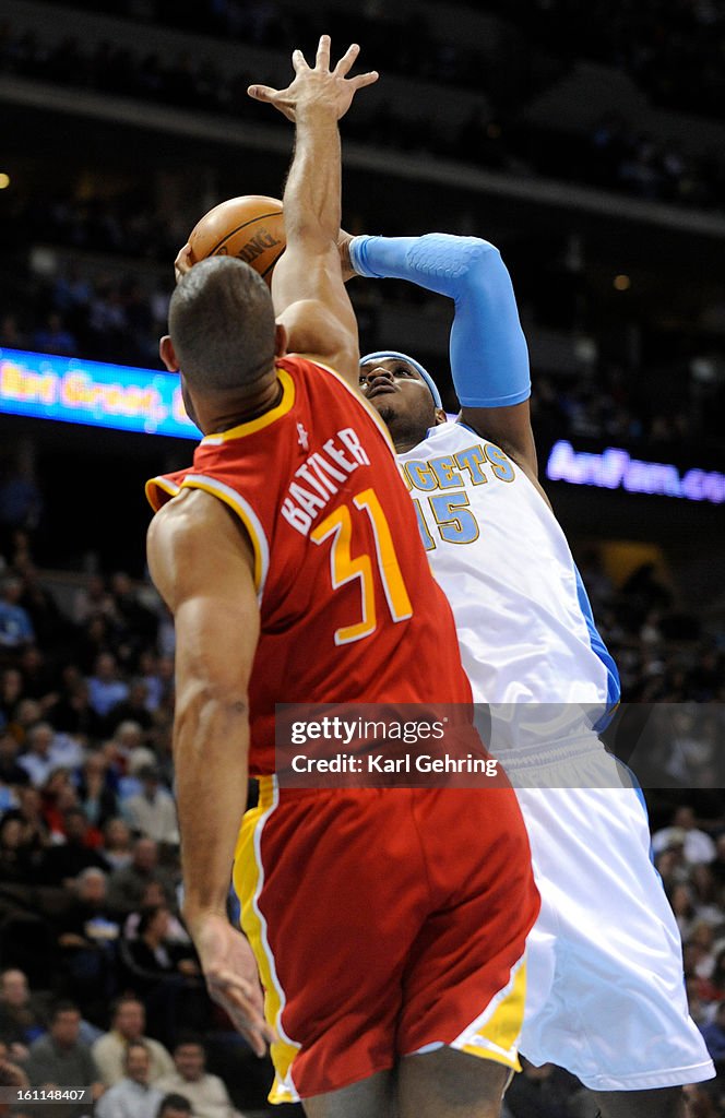 Denver Nuggets forward Carmelo Anthony (15) aimed a shot over Houston Rockets guard Shane Battier (31) in the first half. The Denver Nuggets hosted the Houston Rockets at the Pepsi Center Wednesday night, December 16, 2009. Karl Gehring, The Denver Post