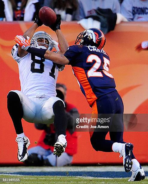 Denver Broncos Tony Carter breaks up a pass play to the Oakland Raiders wide receiver Chaz Schilens during the second quarter of play Sunday December...