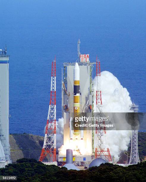 Rocket lifts off from the launch pad, after a series of delays which postponed the original launch date in February, at Tanegashima Space Center...