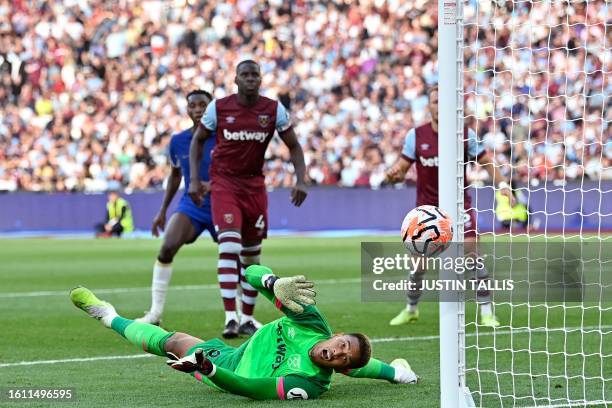 West Ham United's French goalkeeper Alphonse Areola punches the ball away during the English Premier League football match between West Ham United...
