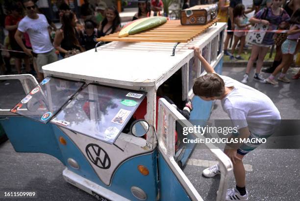 Boy looks at a soapbox cart during the 10th edition of the Rolima do Abacate event during the Virada Cultural festival in Belo Horizonte, state of...