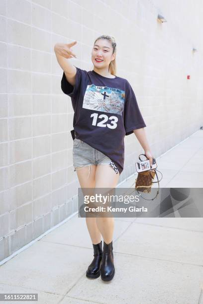 Li Meng of the Washington Mystics arrives to the arena before the game against the Dallas Wings on August 20, 2023 at Entertainment & Sports Arena in...