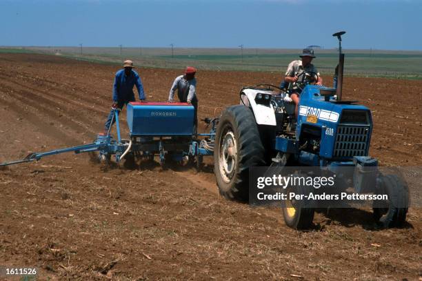 White farmer works his fields with his tractor June 22, 2001 outside Vryburg a farming town about 400 kilometers west of Johannesburg, South Africa....