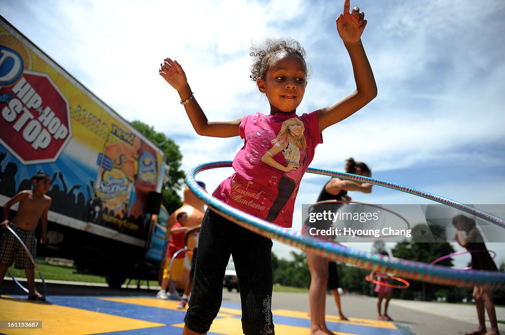 (JS)Imani Mills, 5, of Denver is Hula Hooping during Denver Black Art Festival at City Park on Friday. Hyoung Chang/ The Denver Post