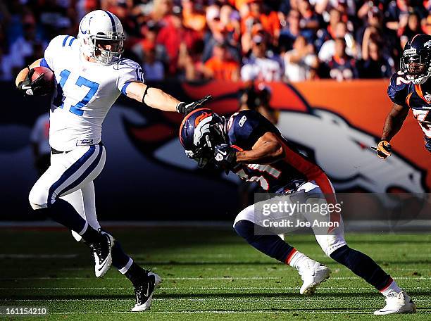 Denver Broncos safety Darcel McBath, right, chases down the Indianapolis Colts' Austin Collie during the third quarter of play Sunday, September 26,...