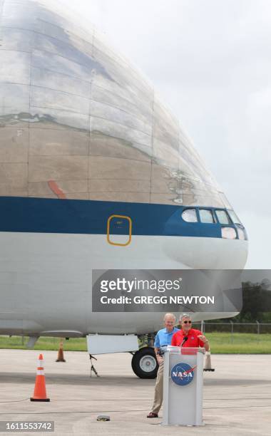 Administrator Bill Nelson and associate administrator of NASA Bob Cabana stand in front of a 1960's-era B377SGT Super Guppy Turbine Cargo Airplane,...
