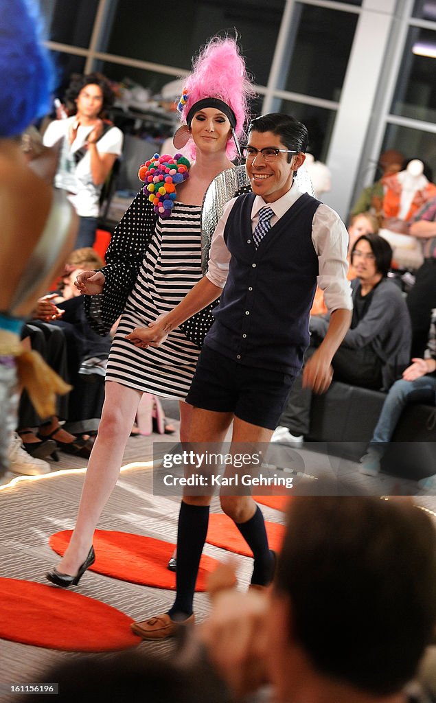 Designer Mondo celebrated his win in an offbeat style competition at the Denver Art Museum Friday night. With the help of assistant Meredith Murphy clothing designer Armando Guerra ("Mondo") put together a new outfit out of recycled cloth, raw materials a