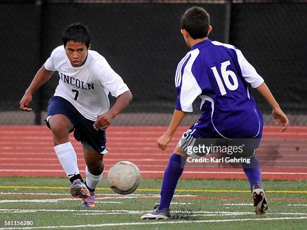 Lincoln senior Jorge Velasquez looked for a way around Vikings defender Ferny Gutierrez in the first half. The Lincoln High School boys soccer team...