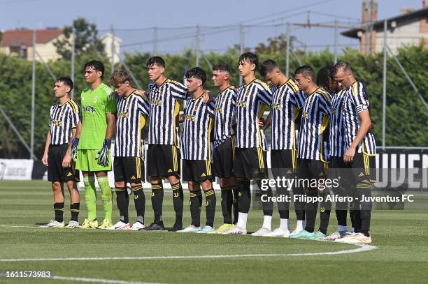 Juventus players observe a minute's silence during the friendly match between Juventus Next Gen and Novara at Juventus Center Vinovo on August 20,...