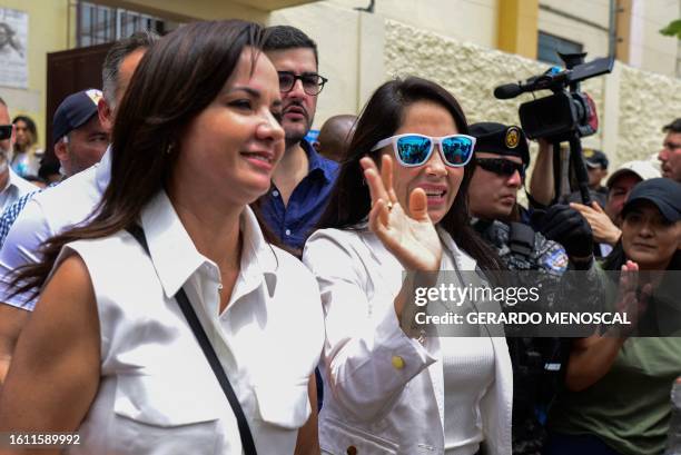 Ecuador's presidential candidate for the Revolucion Ciudadana party, Luisa Gonzalez, waves as she accompanies Guayas Province prefect Marcela...