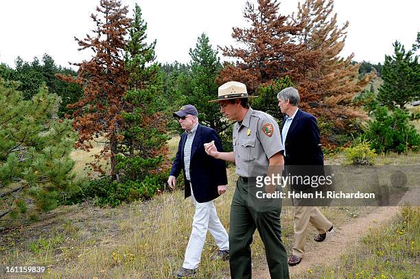 Ben Bobowski, Chief of Resourse Stewardship for Rocky Mountain National Park leads Senators John McCain, left and Mark Udall on a small tour inside...