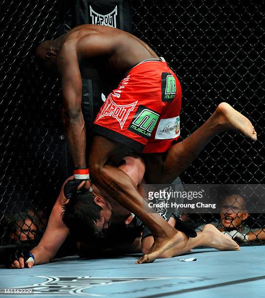 Cheick Kongo, top, controls the fight against Paul Buentello during the Heavy Weight of UFC fights at the first bank center on Suday. Kongo won the...
