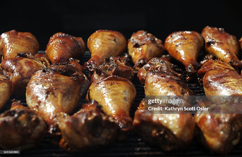 Giant turkey legs sizzle on the grill at the Downtown Denver Partnership's A Taste of Colorado at Civic Center Park in downtown Denver. Since 1984, the Festival has offerd food and beverage along with music and events just for kids. It also highlights per