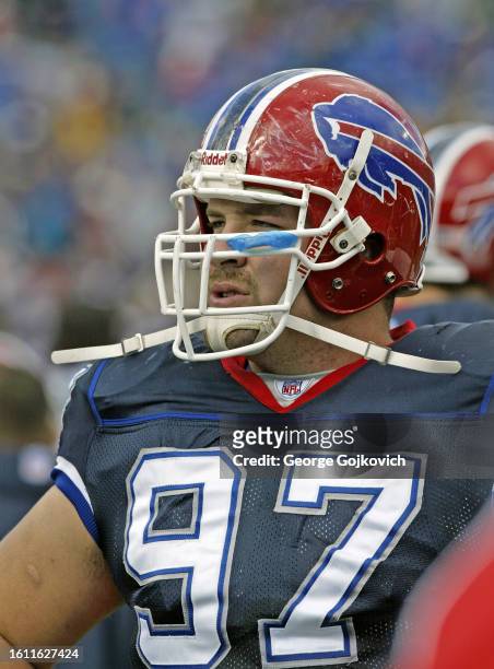 Justin Bannan of the Buffalo Bills looks on from the field before a game against the Cincinnati Bengals at Ralph Wilson Stadium on October 5, 2003 in...