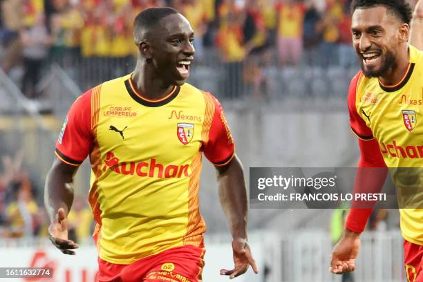 Lens' Colombian defender Deiver Machado celebrates after he scored a first goal for his team during the French L1 football match between RC Lens and...