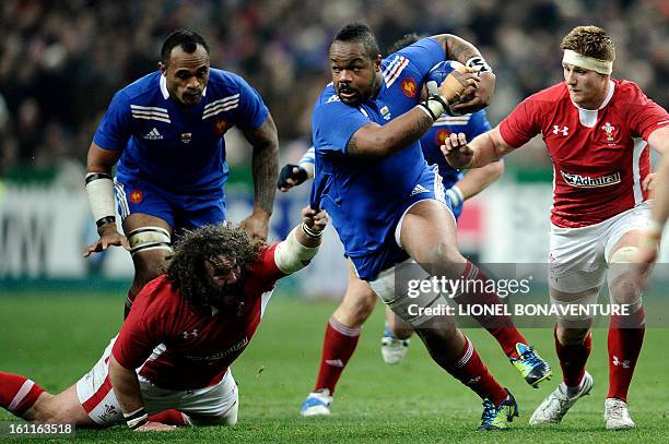 French center Mathieu Bastareaud vies with Wales' prop Adam Jones during the Six Nations Rugby Union match between France and Wales at the Stade de...