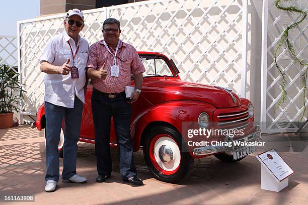 Phil Read poses with Adil Darukhanawala with his 1949 500c Fiat during Cartier 'Travel With Style' Concours 2013 Opening at Taj Lands End on February...