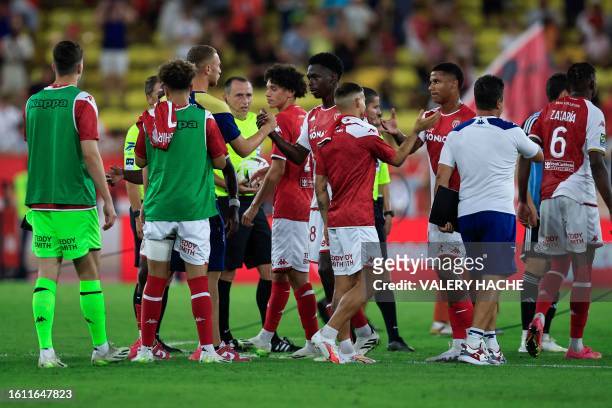 Monaco's players celebrate at the end of the French L1 football match between AS Monaco and RC Strasbourg at the Louis II Stadium in the Principality...