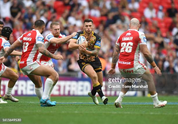 Rowan Milnes of Hull Kingston Rovers challenges Tom Briscoe of Leigh Leopards during Betfred Men's Challenge Cup Final match between Hull Kingston...
