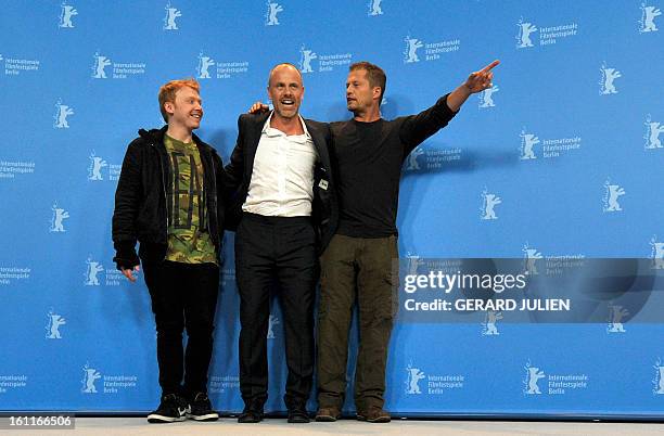 British actor Rupert Grint, Swedish director Fredrik Bond and German actor Til Schweiger pose at a photocall for the film "The Necessary Death of...