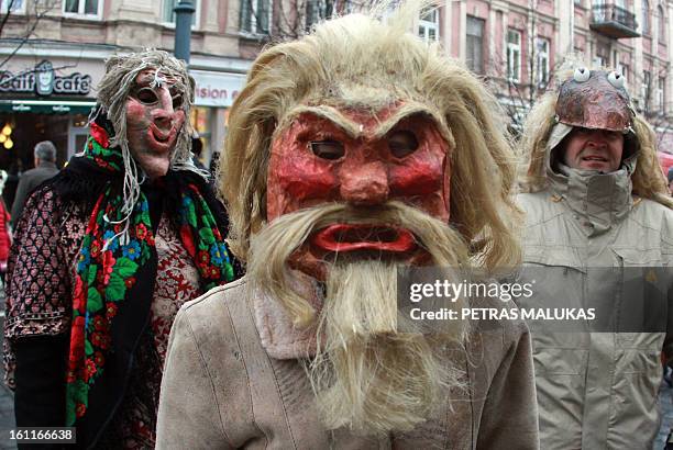 Revellers wear masks of gypsies, horses and goats parade through the streets of the old town of Vilnius to celebrate ‘Uzgavenes’ or 'the time before...