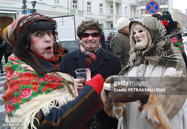 Revellers parade through the streets of the old town of Vilnius to celebrate ‘Uzgavenes’ or 'the time before lent' on February 9, 2013. 'Uzgavenes'...