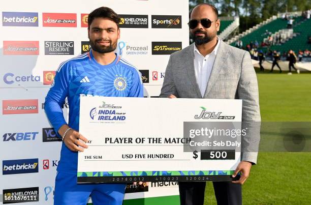 Dublin , Ireland - 20 August 2023; Rinku Singh of India is presented with the Player of the Match award by Joy E-Bike vice president Sajid Malek...