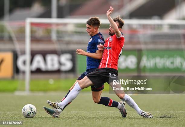 Derry , United Kingdom - 20 August 2023; Adam Murphy of St Patrick's Athletic in action against Cameron Dummigan of Derry City during the Sports...