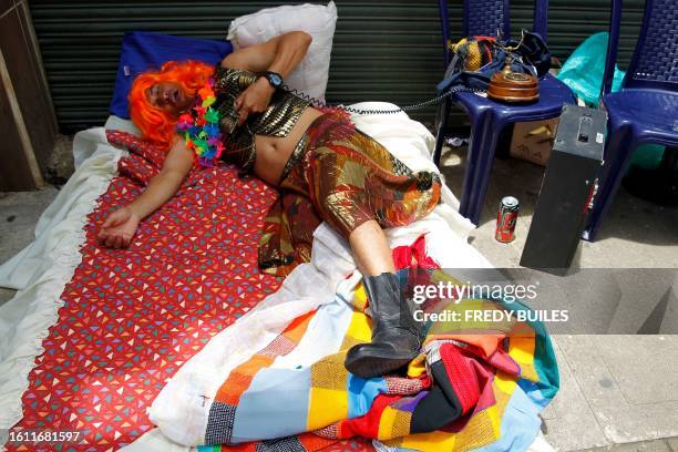 Man simulates to be asleep during the celebration of World Day of Laziness in Itagui, Colombia, on August 20, 2023.